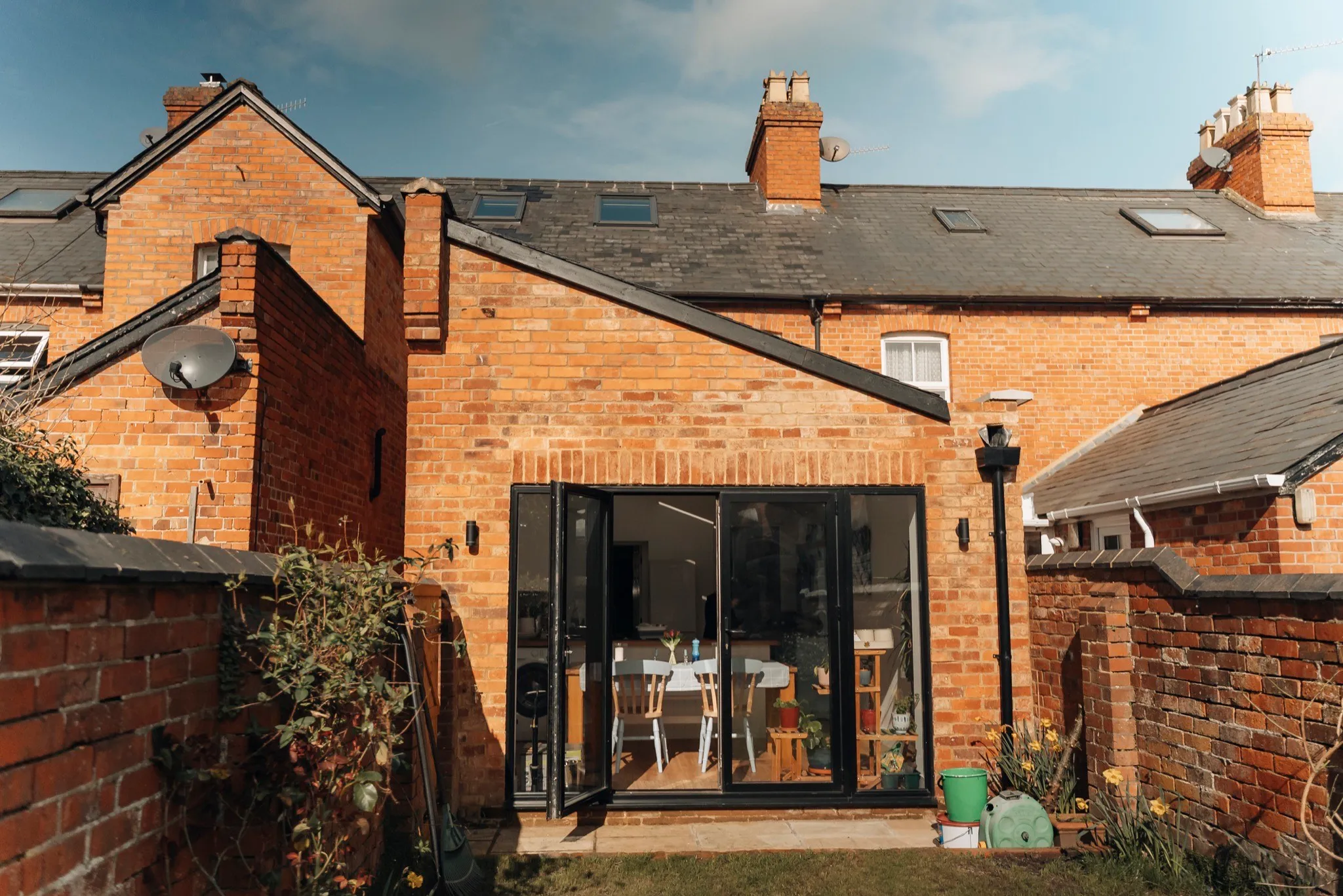 A Prestige Surrey glass extension on a red-brick home in Henley