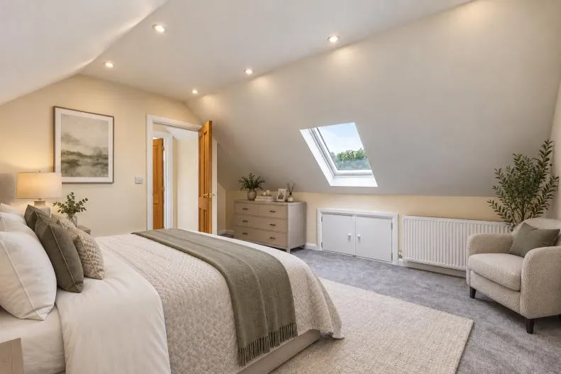 Second-floor principal bedroom with vaulted ceiling and roof light